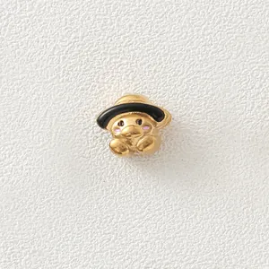Detailed macro view of 18K gold-plated duck bead with black hat for DIY jewelry making
