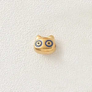 Macro view of a gold-plated stainless steel cartoon animal bead for DIY jewelry making.