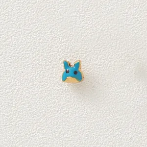 Close-up of a cute blue enamel cartoon pig bead for DIY jewelry making