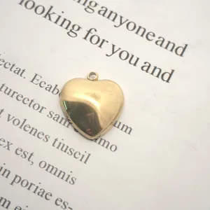 Close-up of golden stainless steel heart charm for DIY necklace and bracelet