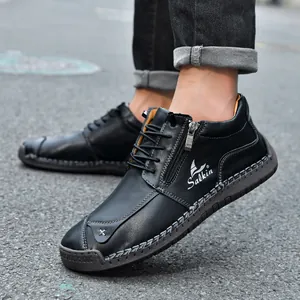Detail of hand-stitched black casual shoes with side zipper and Salkin logo