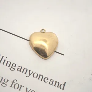 High-quality close-up of a gold heart pendant accessory with a welded ring for DIY jewelry making