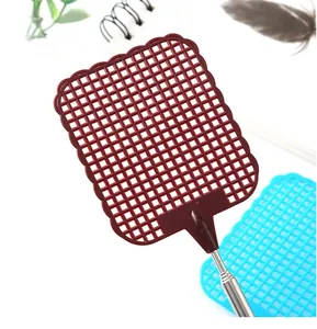 Macro detail of a brown telescopic fly swatter mesh head and stainless steel handle