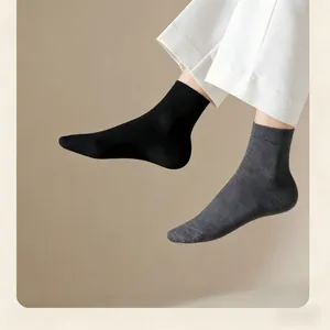 Close-up of men's thin cotton socks in black and dark grey colors