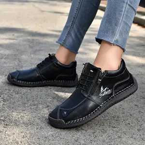 Detailed view of black hand-stitched leather casual shoes featuring a functional side zipper