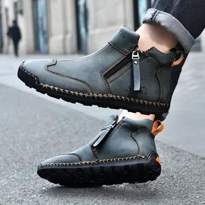 Detailed view of hand-stitched leather Martin boots with side zipper design