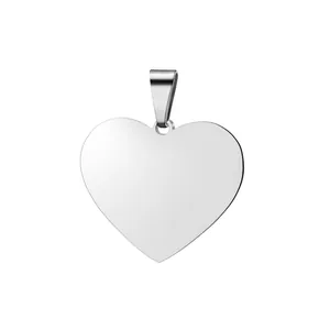 Close-up of a polished stainless steel heart shaped pendant with a high gloss smooth finish