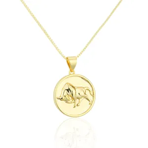 Detailed macro view of the 18K gold plated Taurus zodiac bull relief pendant necklace.