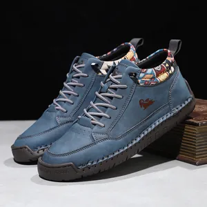 Detail view of blue mid-top Martin boots with patterned collar and hand-stitched sole