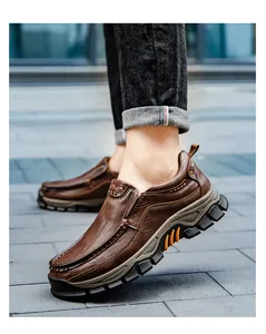 Close-up detail of brown men's outdoor casual leather shoes with thick rugged soles