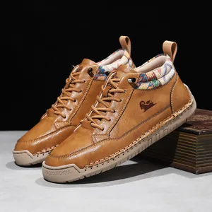 Detailed view of brown leather mid-top casual Martin boots with ethnic patterned collar detail