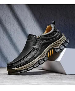 Side view of black leather outdoor shoes with durable thick rubber lug soles.