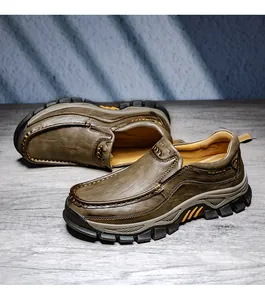 Detailed view of the rugged rubber sole and stitching on men's outdoor leather shoes