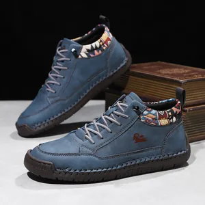 Blue suede mid-top Martin boots with hand-stitched detailing and decorative collar