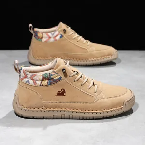 Detail of khaki mid-top Martin boots featuring ethnic pattern collar and hand-stitched sole