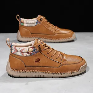 Detailed view of brown leather Martin boots with hand-stitched sole and patterned collar.