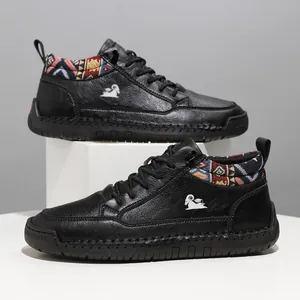 Side view of black mid-top Martin boots with ethnic pattern collar and stitched sole