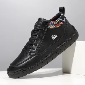 Close-up of black leather mid-top Martin boots featuring ethnic fabric collar design.