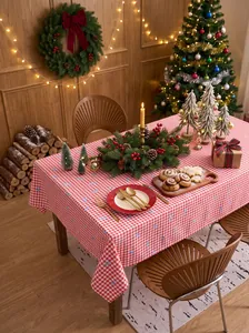 Red and white gingham Christmas tablecloth in a warm festive dining setting