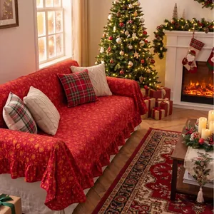 Festive red Christmas sofa cover with gold stamping and ruffled edges in cozy room