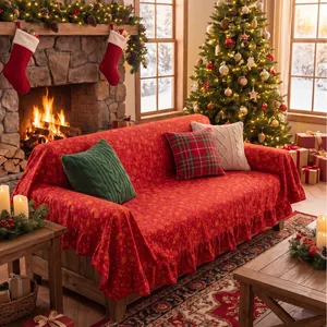 Red Christmas sofa cover with gold stamping and elegant ruffled edges in a cozy room.