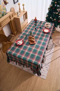 Winter Christmas red and green plaid ruffled tablecloth in American rustic dining room scene
