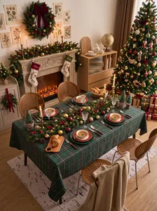 Festive green plaid Christmas tablecloth displayed in a warm, cozy home dining setting