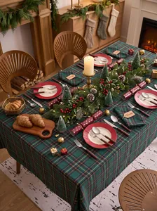 Festive red and green plaid Christmas tablecloth for a traditional holiday dinner setting