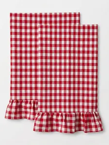 Close-up of red and white gingham checkered hand towels with ruffled edge detail