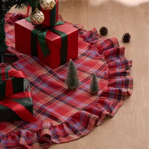 Festive red and blue plaid Christmas tree skirt with elegant ruffled edge decoration for holiday