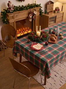 Detailed view of red and green plaid Christmas tablecloth in a cozy festive dining room