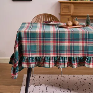 Green and red plaid Christmas tablecloth with ruffled edge for festive dining decor