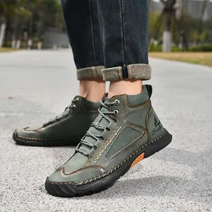 Close-up detail of green men's PU leather ankle boots featuring unique hand-stitched seams.