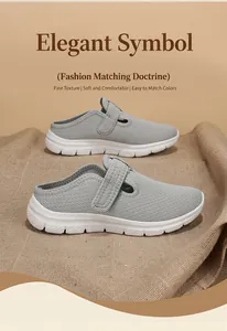 Detail van grijze mesh instappers voor dames met ademend bovenwerk en witte zool.