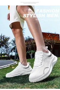 Close-up of lightweight white mesh men's walking shoes on outdoor grass