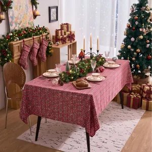 Festive red plaid rectangular tablecloth for Christmas holiday dining table decor.