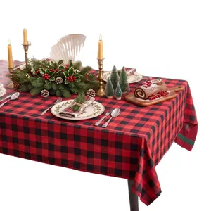 Festive red and black buffalo plaid rectangular tablecloth for Christmas dining decor.