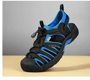 Detailed side view of blue and black outdoor trekking sandal with elastic quick-lace strap