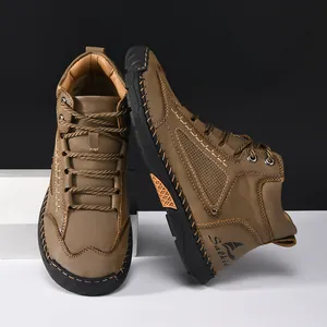 Close-up of men's brown PU leather ankle boots featuring stylish handmade stitching