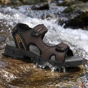 Men's non-slip outdoor leather sandals for beach and hiking in a natural stream setting