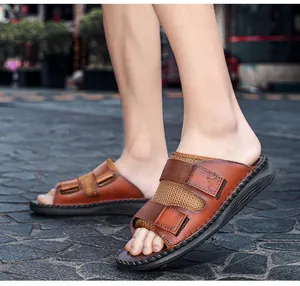 Men's casual brown leather sandals with adjustable velcro straps and breathable mesh panels