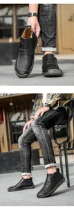 Nahaufnahme von handgenähten schwarzen Leder-Freizeitschuhen mit Reißverschluss.