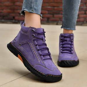 Detailed side view of purple men's ankle boots with exquisite hand-stitching and laces