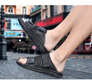 Macro view of black velcro outdoor slides showing adjustable straps and mesh detail