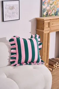 Detail of a pink and green striped velvet cushion cover with elegant ruffled edges.