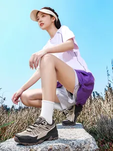 Lightweight breathable hiking shoes for women shown in a professional outdoor trekking scene