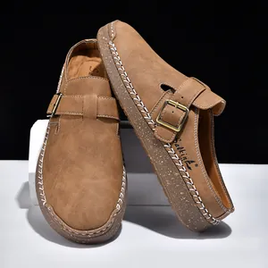 Stylish brown suede loafers featuring white contrast stitching and buckle strap