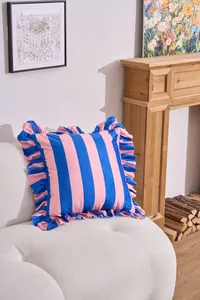 Detailed view of a blue and pink striped Dutch velvet cushion with ruffled edges