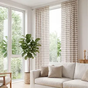 French style striped green curtains with tassels and sheer drapes in a bright living room