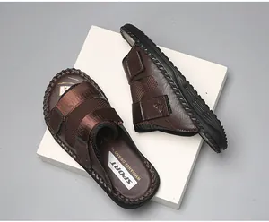 High-quality detail of brown summer sandals featuring mesh fabric and adjustable Velcro straps